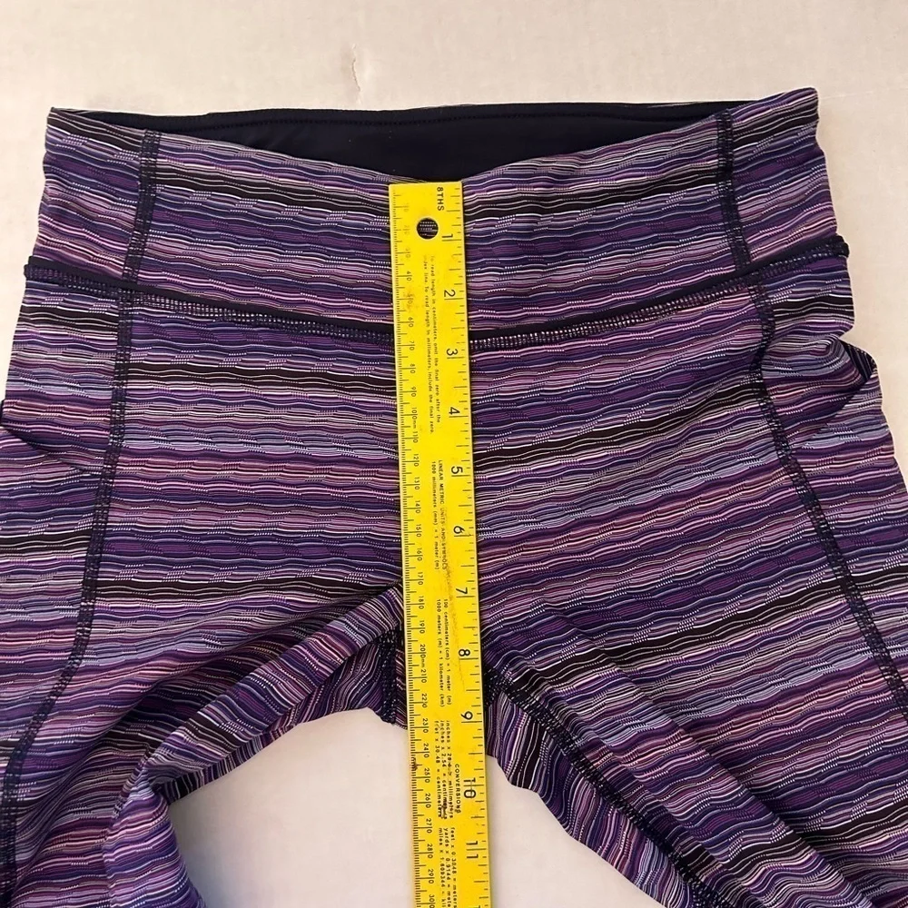 Lululemon striped purple legging w/back zip pocket & 2‎ side pockets Sz-6. Z19